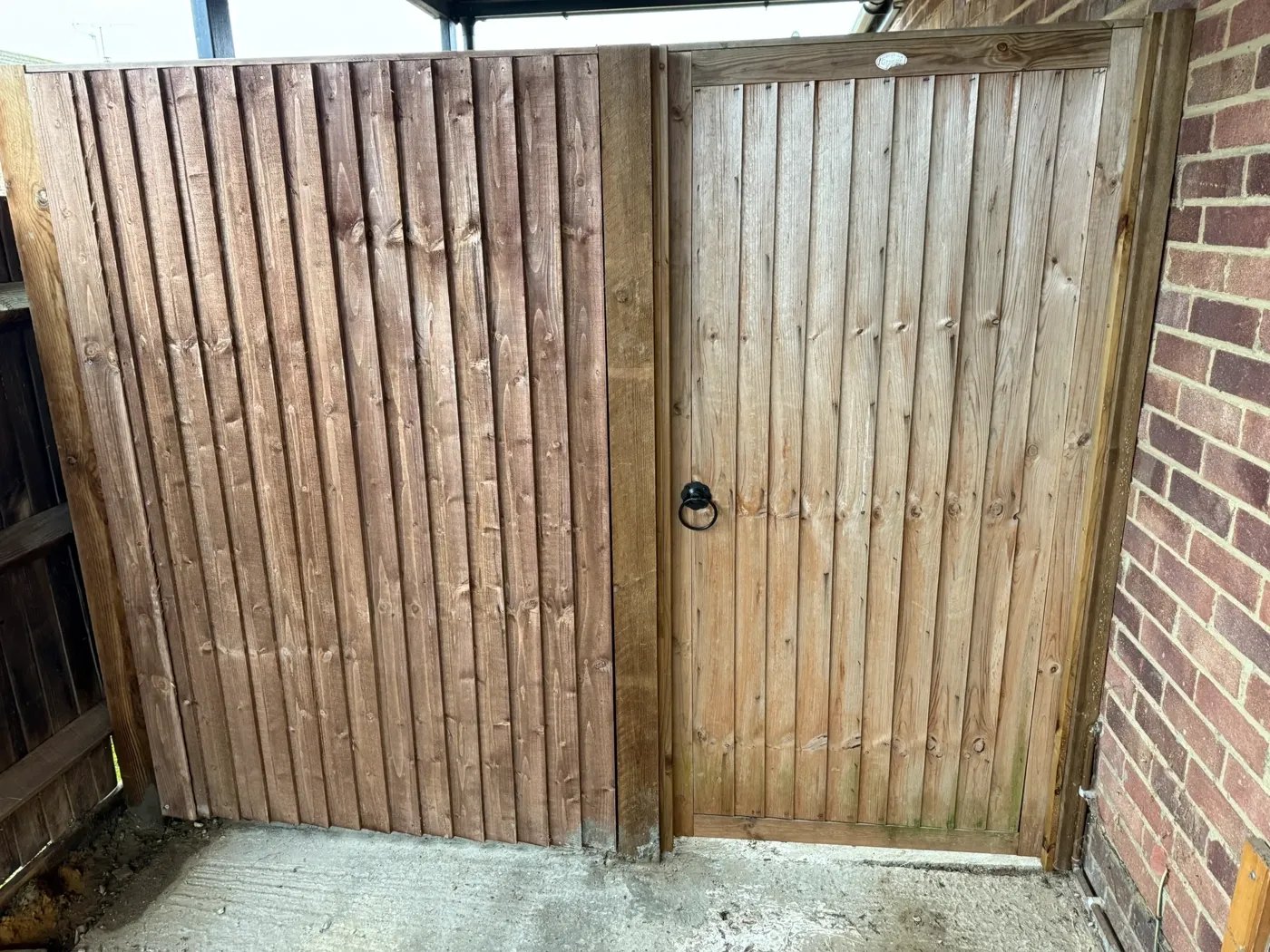 Timber side gate fitted between house and boundary