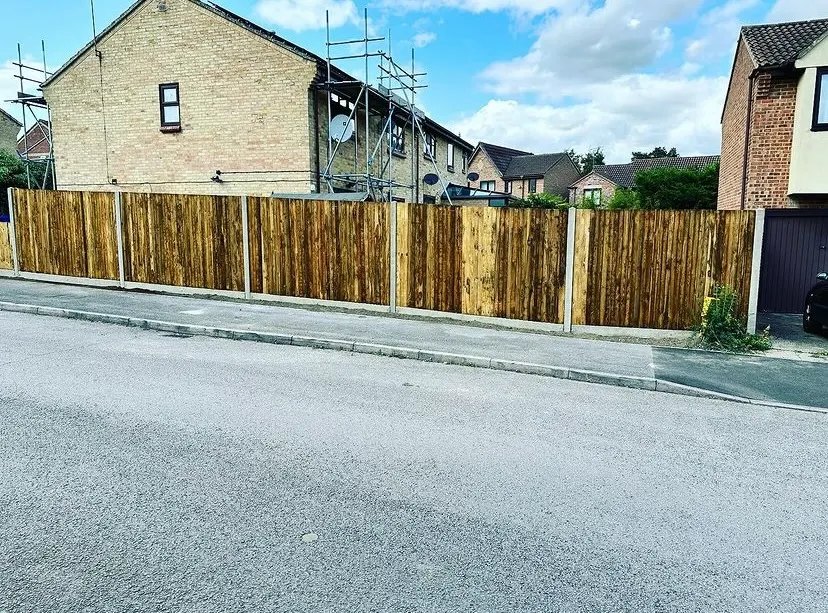 New timber fence panels along a garden boundary